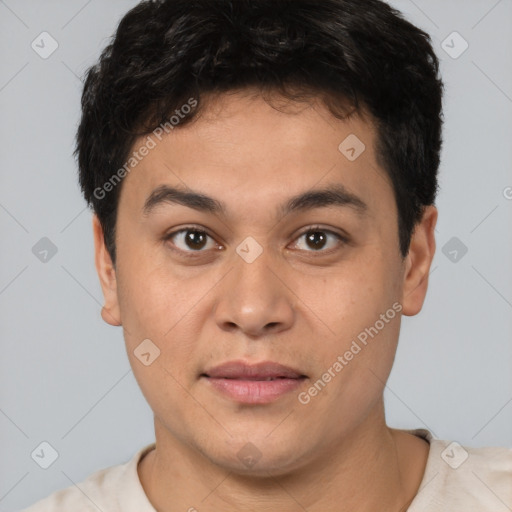 Joyful asian young-adult male with short  brown hair and brown eyes