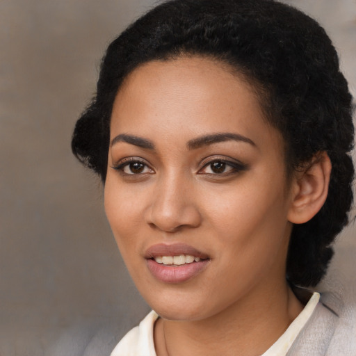Joyful latino young-adult female with medium  black hair and brown eyes