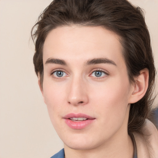 Joyful white young-adult male with medium  brown hair and brown eyes