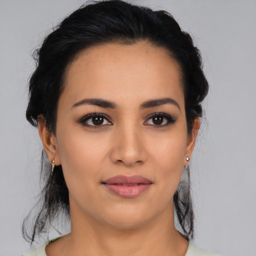 Joyful latino young-adult female with medium  black hair and brown eyes
