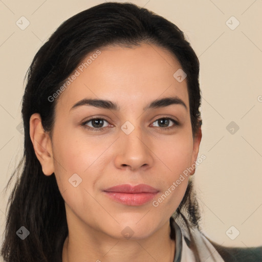 Joyful latino young-adult female with long  brown hair and brown eyes