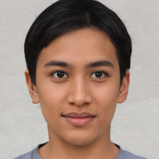 Joyful asian young-adult female with short  black hair and brown eyes