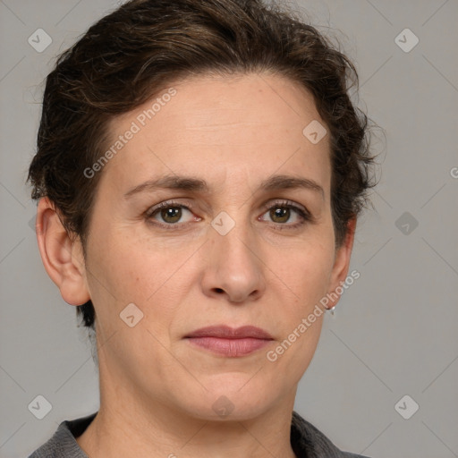 Joyful white adult female with short  brown hair and grey eyes