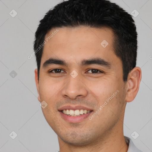 Joyful white young-adult male with short  black hair and brown eyes