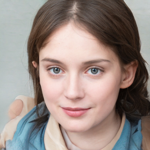 Joyful white young-adult female with medium  brown hair and blue eyes