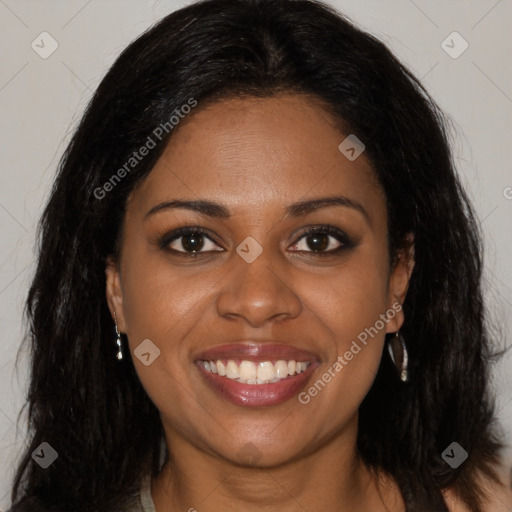 Joyful black young-adult female with long  brown hair and brown eyes