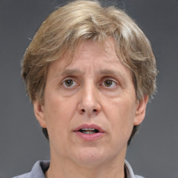 Joyful white middle-aged male with short  brown hair and grey eyes