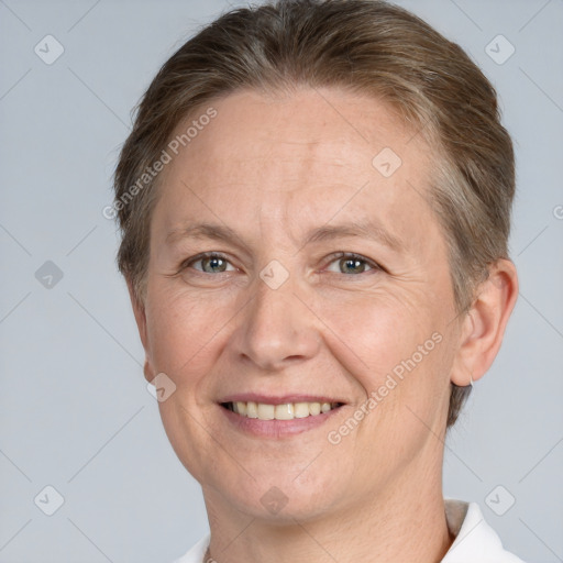 Joyful white adult male with short  brown hair and grey eyes