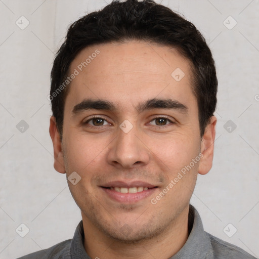 Joyful white young-adult male with short  black hair and brown eyes