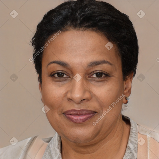 Joyful latino adult female with short  brown hair and brown eyes