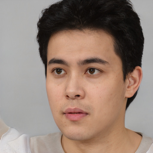 Neutral white young-adult male with short  black hair and brown eyes