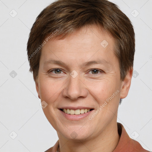 Joyful white adult male with short  brown hair and grey eyes