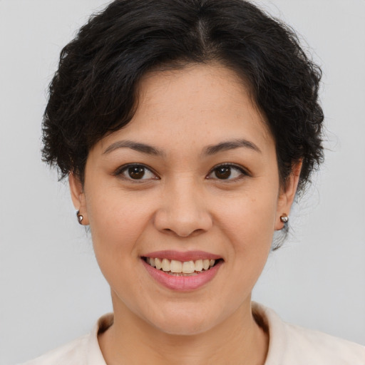 Joyful asian young-adult female with short  brown hair and brown eyes