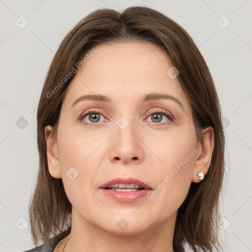 Joyful white adult female with medium  brown hair and grey eyes