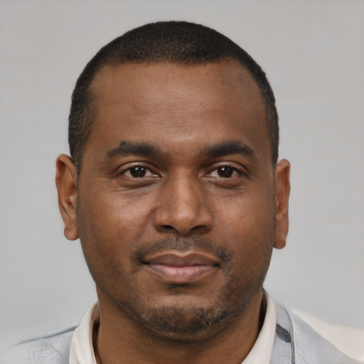 Neutral black young-adult male with short  brown hair and brown eyes