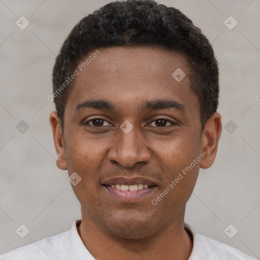 Joyful latino young-adult male with short  brown hair and brown eyes