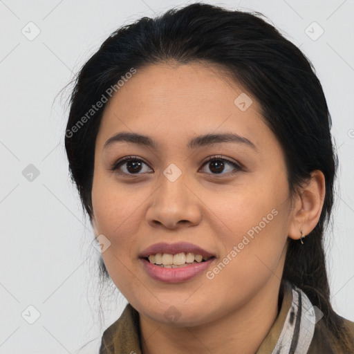 Joyful latino young-adult female with medium  brown hair and brown eyes