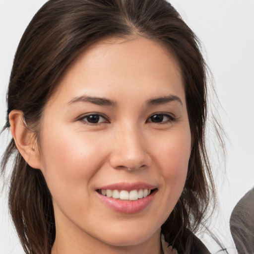 Joyful white young-adult female with medium  brown hair and brown eyes