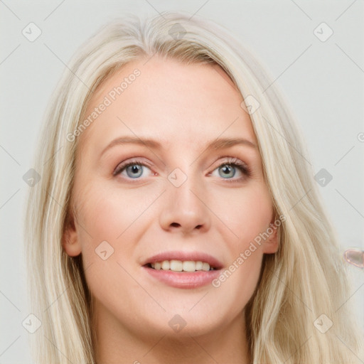 Joyful white young-adult female with long  blond hair and blue eyes