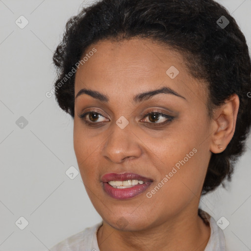 Joyful black young-adult female with short  brown hair and brown eyes