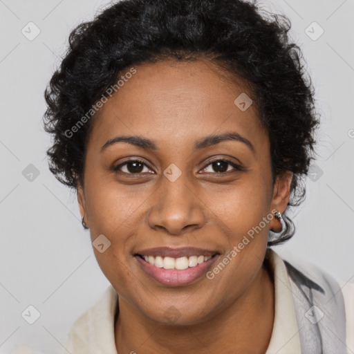 Joyful black young-adult female with short  brown hair and brown eyes