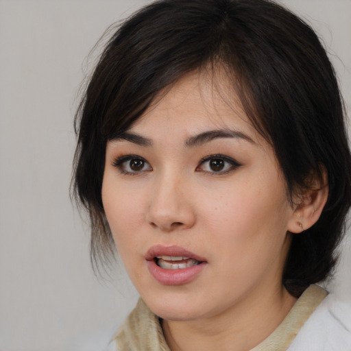 Neutral asian young-adult female with medium  brown hair and brown eyes