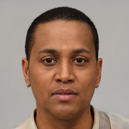 Neutral latino young-adult male with short  brown hair and brown eyes