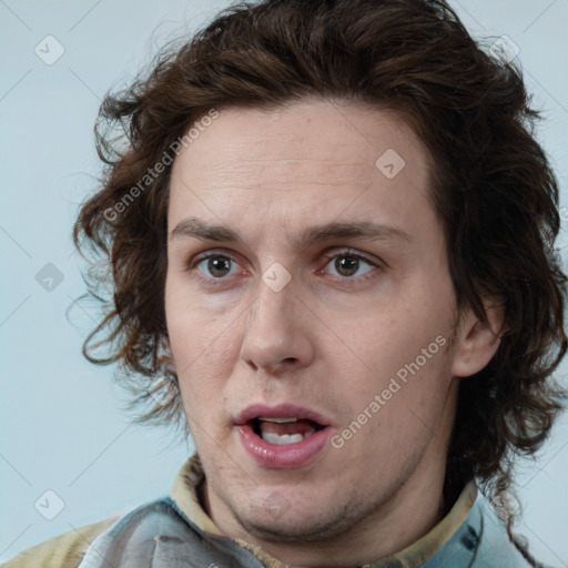 Joyful white adult male with medium  brown hair and brown eyes