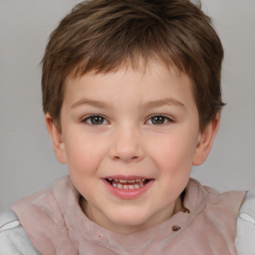 Joyful white child male with short  brown hair and brown eyes