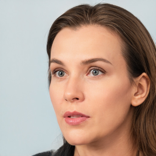 Neutral white young-adult female with long  brown hair and grey eyes