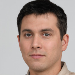 Neutral white young-adult male with short  black hair and brown eyes