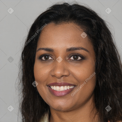 Joyful black young-adult female with long  brown hair and brown eyes