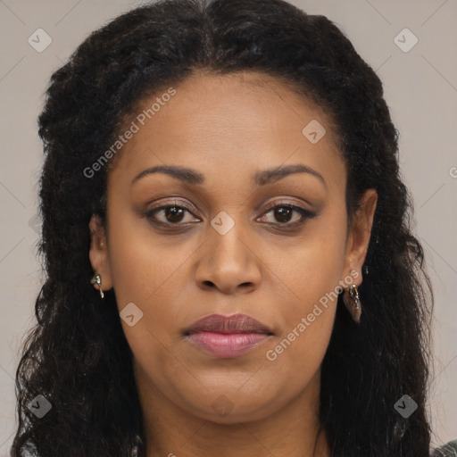 Joyful black young-adult female with long  brown hair and brown eyes