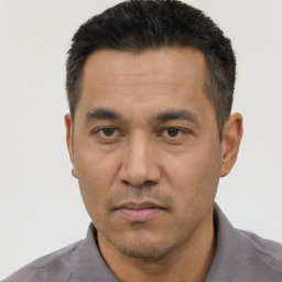Neutral asian adult male with short  black hair and brown eyes