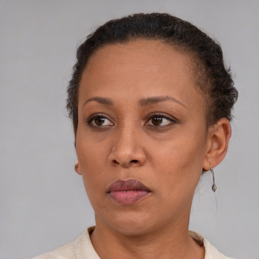 Neutral black adult female with short  brown hair and brown eyes