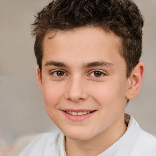 Joyful white child male with short  brown hair and brown eyes