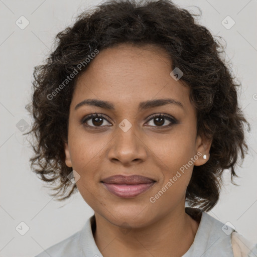 Joyful black young-adult female with medium  brown hair and brown eyes