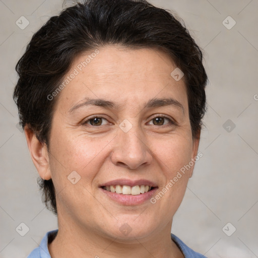 Joyful white adult female with short  brown hair and brown eyes