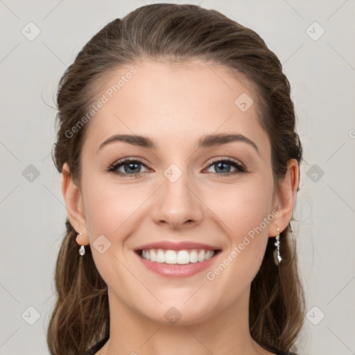 Joyful white young-adult female with long  brown hair and grey eyes