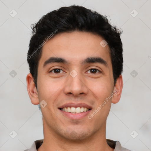 Joyful white young-adult male with short  black hair and brown eyes