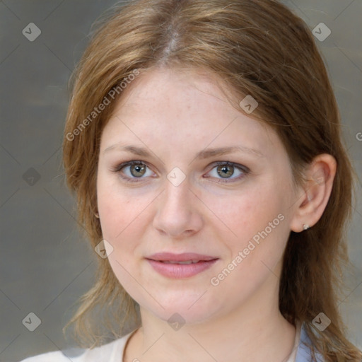 Joyful white young-adult female with medium  brown hair and blue eyes