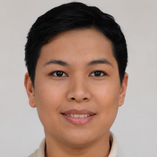 Joyful asian young-adult female with short  black hair and brown eyes