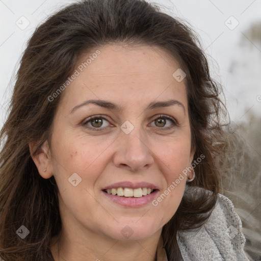 Joyful white adult female with long  brown hair and brown eyes