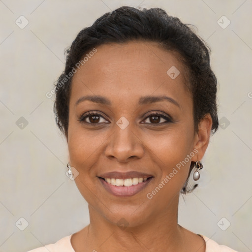 Joyful latino young-adult female with short  brown hair and brown eyes