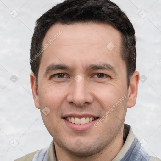 Joyful white adult male with short  brown hair and brown eyes