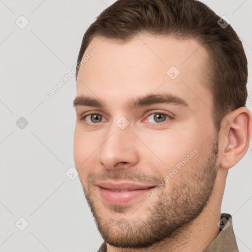 Joyful white young-adult male with short  brown hair and brown eyes