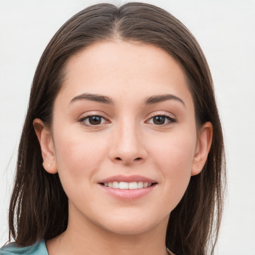 Joyful white young-adult female with long  brown hair and grey eyes