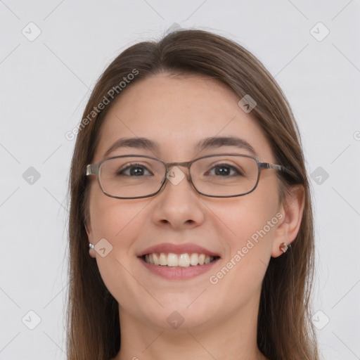 Joyful white young-adult female with long  brown hair and grey eyes