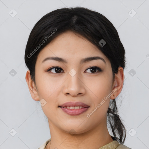 Joyful asian young-adult female with medium  black hair and brown eyes