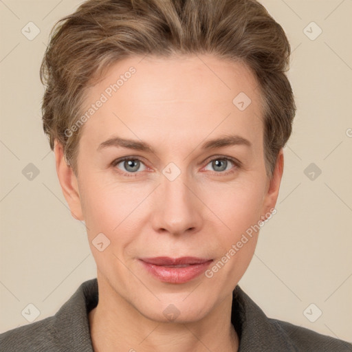 Joyful white adult female with short  brown hair and grey eyes